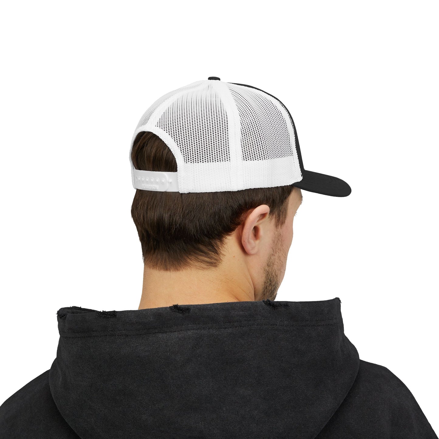 LOVE NEVER FAILS TRUCKER HAT