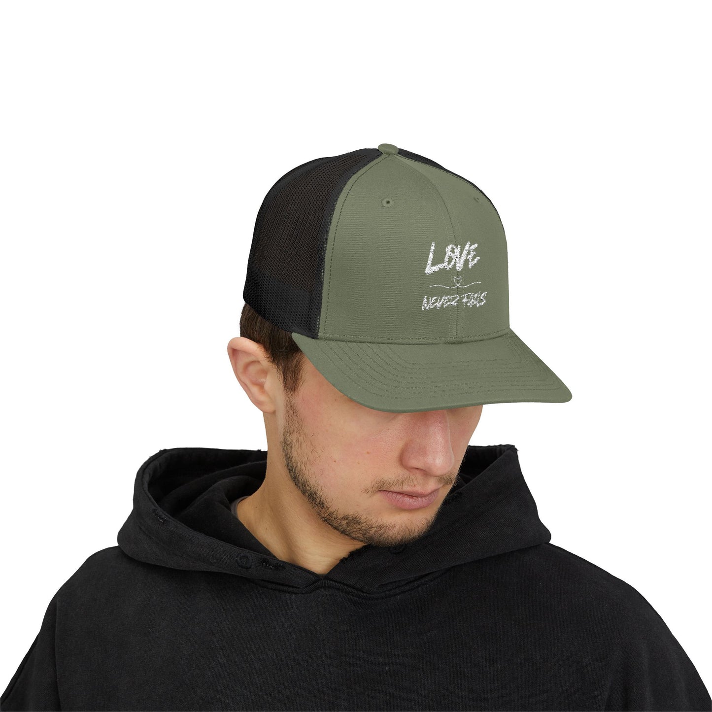 LOVE NEVER FAILS TRUCKER HAT