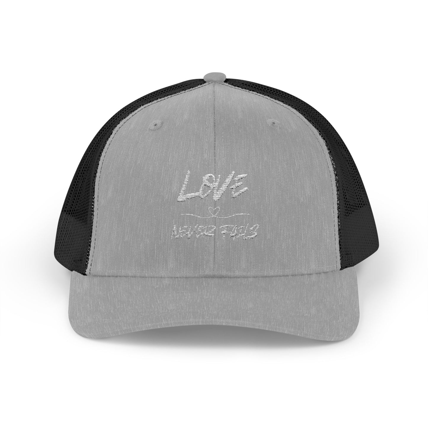 LOVE NEVER FAILS TRUCKER HAT