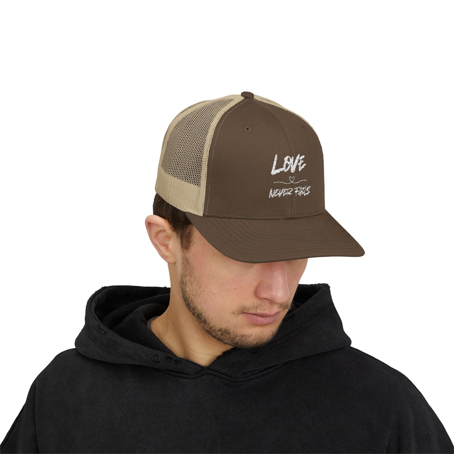 LOVE NEVER FAILS TRUCKER HAT